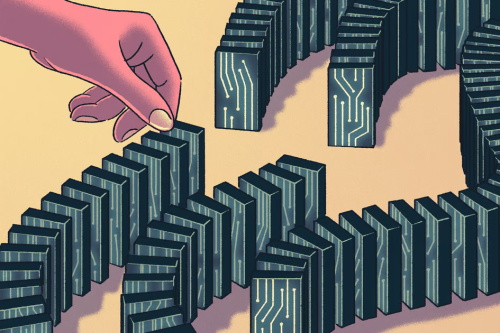 Hand starting a chain of circuit-patterned dominoes