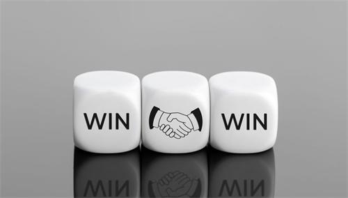 Three dice showing "WIN," a handshake, and "WIN," representing a win-win partnership